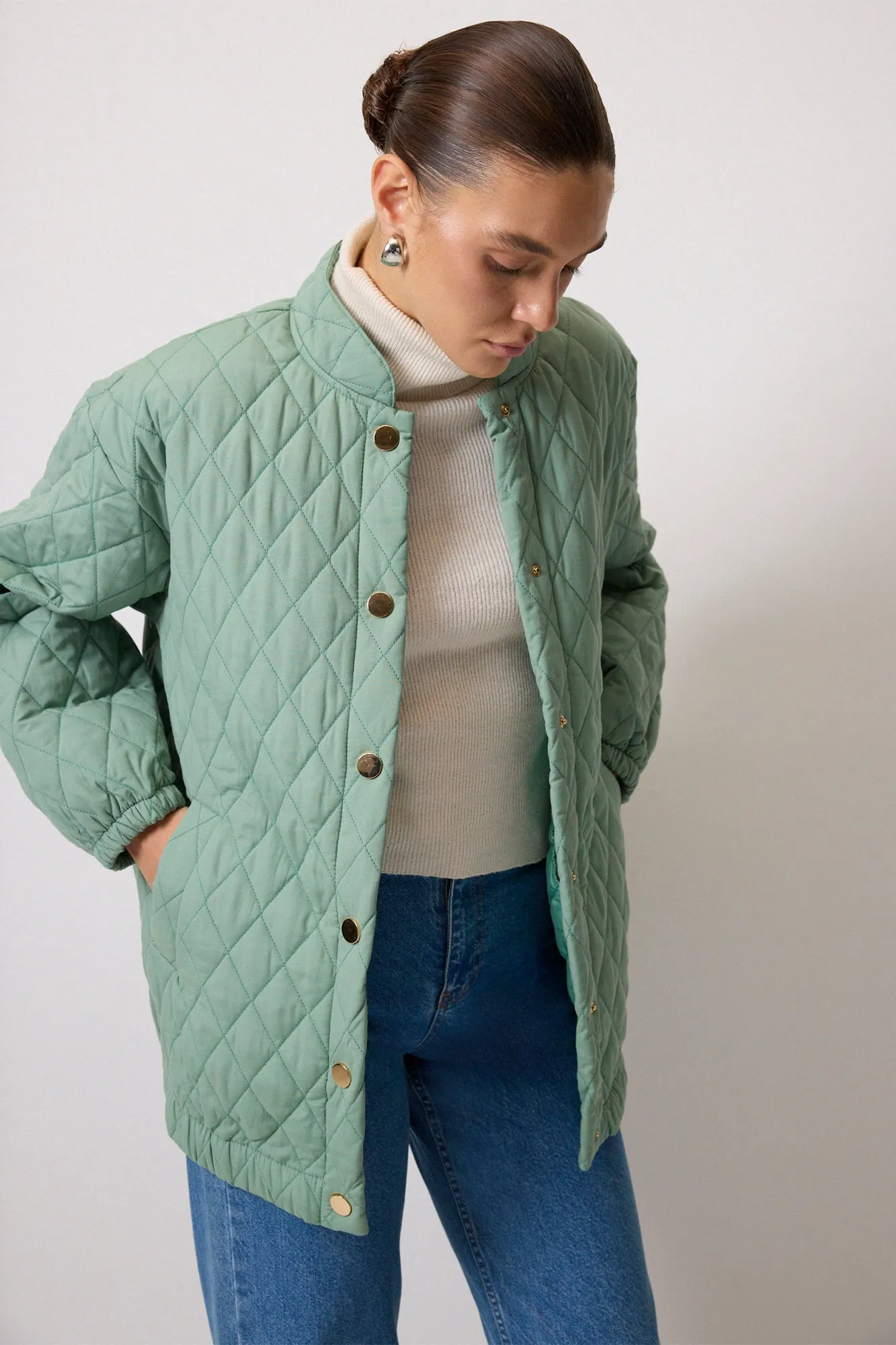 QUILTED COAT WITH STAPLES